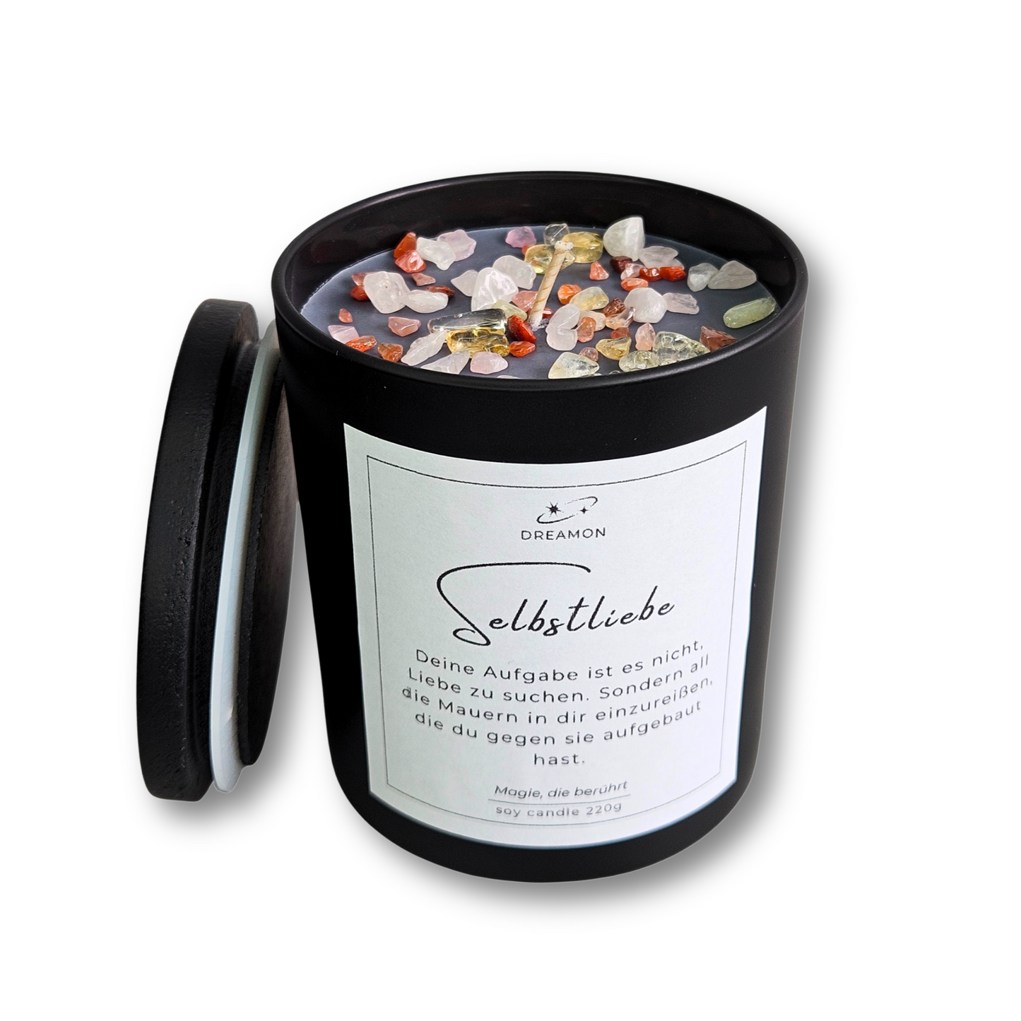 Intuitionskerze „Selbstliebe im schwarzen Glas mit Heilsteinen (Rosenquarz, Citrin und Karneol), Zitatetikett und Holzdeckel.