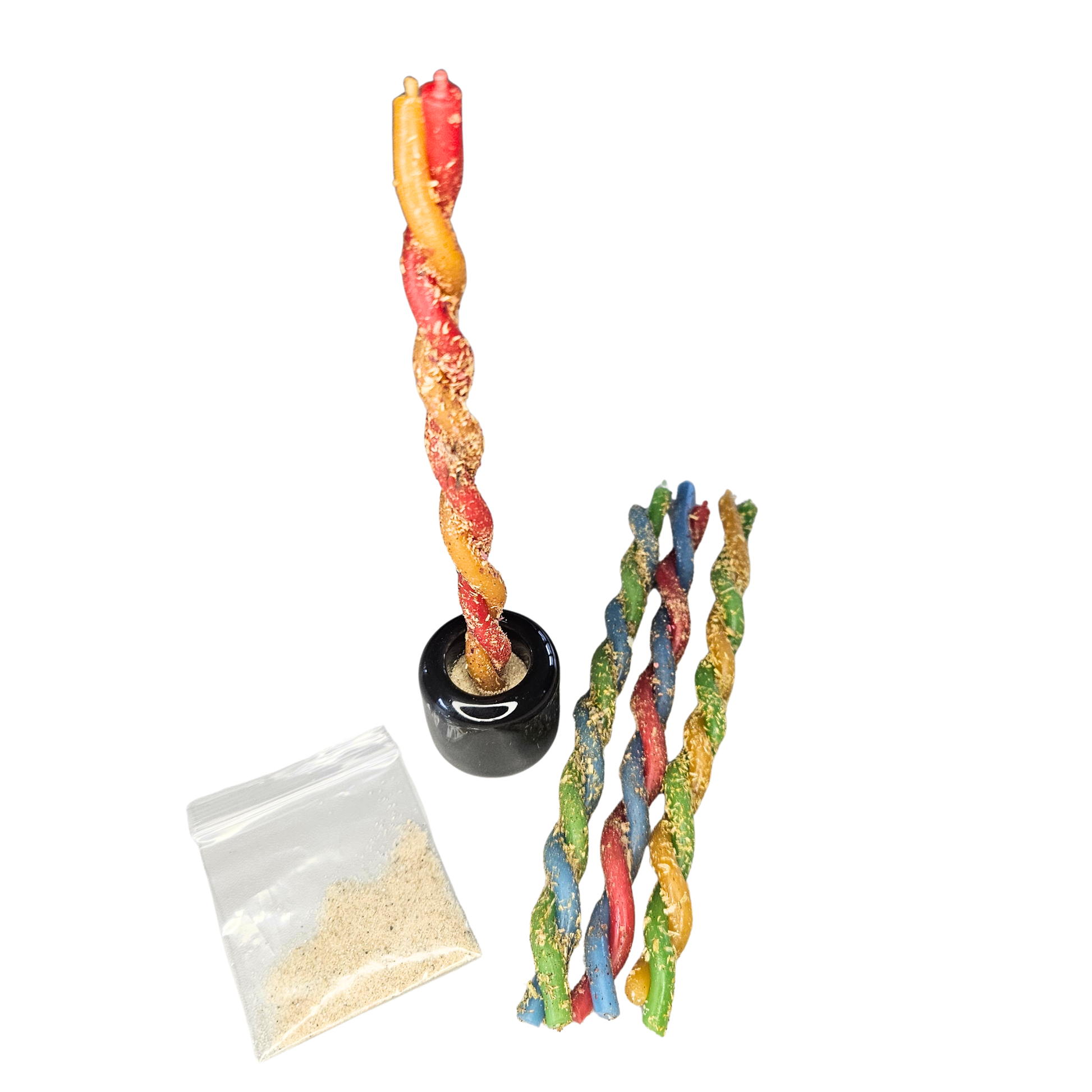 Gesalbte rote-gelbe Duo-Kerze im schwarzen Keramikhalter mit Sandbeutel und weiteren farbigen Ritualkerzen – Sacred Balance Bienenwachskerzen Set.